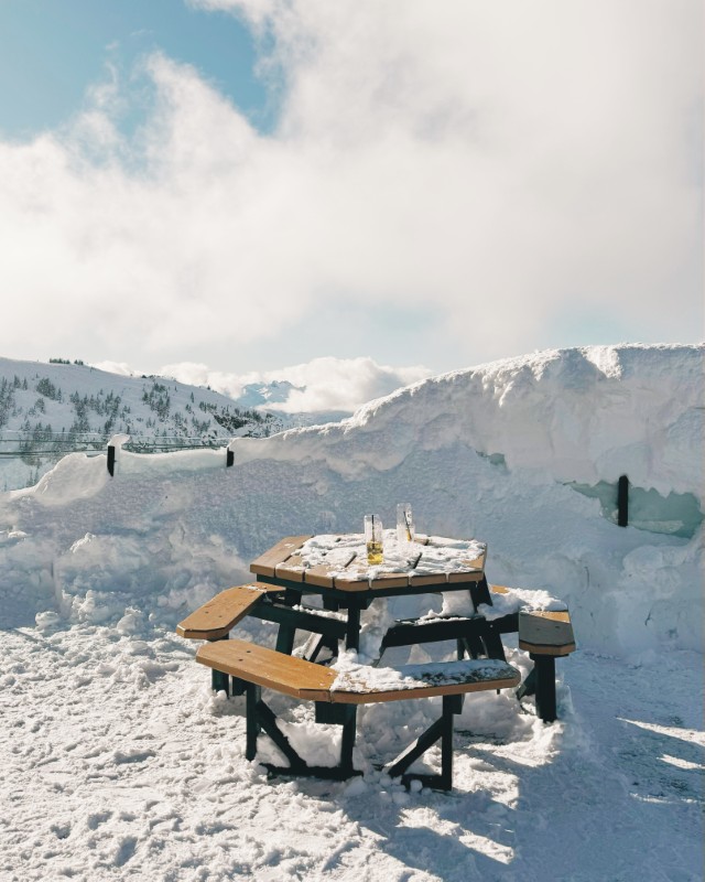 Snowy picnic tables in the mountains