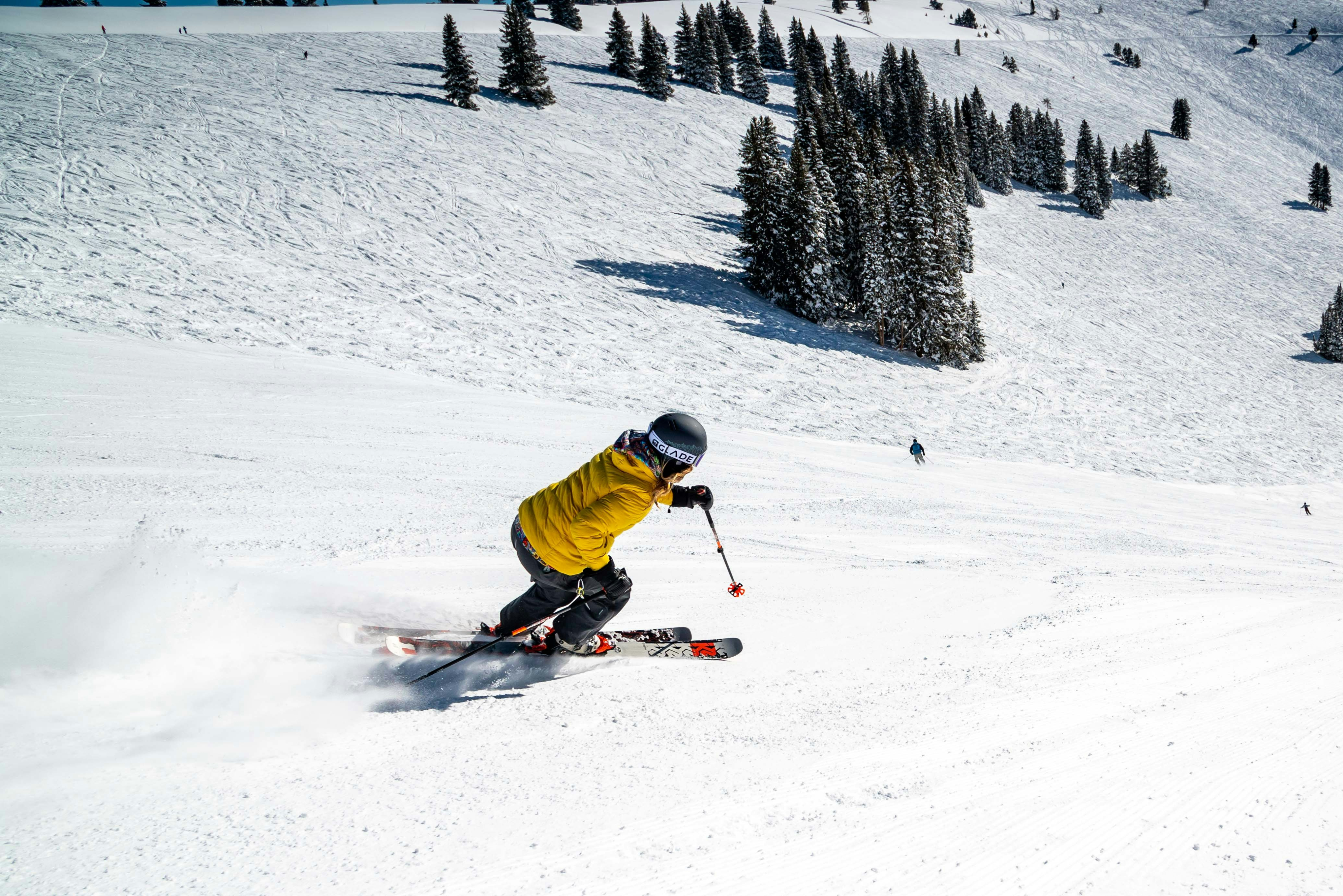 Skier carving on a snowy slope