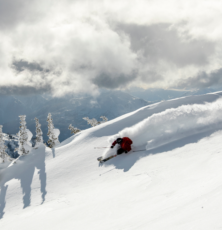Skier descending through powder